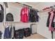 Walk-in closet with ample shelving and rod space at 12509 W Whyman St, Avondale, AZ 85323