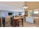 Cozy dining area featuring tile floors and stylish lighting at 12509 W Whyman St, Avondale, AZ 85323