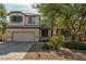 Charming two-story home with a well-manicured lawn and a two-car garage at 12509 W Whyman St, Avondale, AZ 85323