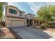 Charming two-story home with a well-manicured lawn and a two-car garage at 12509 W Whyman St, Avondale, AZ 85323