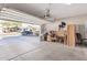 Spacious garage with ample parking and storage, garage door is open and inviting at 12509 W Whyman St, Avondale, AZ 85323