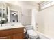 This bathroom features a shower-tub combo and modern fixtures at 1375 S 225Th Ln, Buckeye, AZ 85326