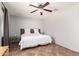 Comfortable bedroom featuring a ceiling fan, neutral colors and tile floors at 1375 S 225Th Ln, Buckeye, AZ 85326