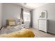 Cozy bedroom featuring neutral walls and a window at 1375 S 225Th Ln, Buckeye, AZ 85326