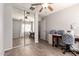 Bedroom featuring mirrored closet doors and a ceiling fan at 1375 S 225Th Ln, Buckeye, AZ 85326