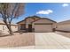 Charming single-Gathering home with neutral stucco, desert landscaping and an attached two car garage at 1375 S 225Th Ln, Buckeye, AZ 85326