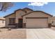 Charming single-Gathering home with neutral stucco, desert landscaping and an attached two car garage at 1375 S 225Th Ln, Buckeye, AZ 85326