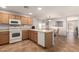 Functional kitchen showcases ample cabinetry, a full appliance package, and connectivity with the dining area at 1375 S 225Th Ln, Buckeye, AZ 85326