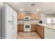 Efficient kitchen design with generous counter space, full-size appliances, and bright, natural lighting at 1375 S 225Th Ln, Buckeye, AZ 85326