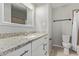 Bathroom featuring granite countertops, white cabinets, mirror, toilet and shower at 1409 E Verlea Dr, Tempe, AZ 85282