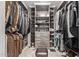 Walk-in closet with built-in shelving, drawers, and ample space for clothes and accessories at 1409 E Verlea Dr, Tempe, AZ 85282