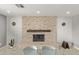 Well-lit dining area featuring a stone fireplace and a glass-top table with seating at 1409 E Verlea Dr, Tempe, AZ 85282