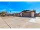 Single-story brick home with a large driveway and attached two car garage at 1409 E Verlea Dr, Tempe, AZ 85282