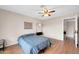 An additional angle of the bedroom featuring a ceiling fan and wood laminate floors at 1430 W Rockwood Dr, Phoenix, AZ 85027