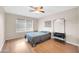 Spacious bedroom illuminated by natural light with ceiling fan and laminate floors at 1430 W Rockwood Dr, Phoenix, AZ 85027