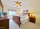 Comfortable bedroom with a ceiling fan, a cozy bed, and ample lighting at 145 N 74Th St # 256, Mesa, AZ 85207