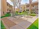 Inviting outdoor picnic and grill area with manicured landscaping and plenty of seating for residents to enjoy at 145 N 74Th St # 256, Mesa, AZ 85207