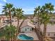 Aerial view of home with a pool, a brick fence and lush tropical landscaping at 16611 N 19Th St, Phoenix, AZ 85022