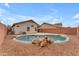 Backyard featuring pool with rock accents, desert landscaping, and privacy fence at 16611 N 19Th St, Phoenix, AZ 85022