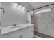 Modern bathroom featuring tile, granite countertops, and walk-in shower at 16611 N 19Th St, Phoenix, AZ 85022