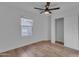 Bedroom featuring a sliding door closet, light wood floors and bright natural light from a window at 16611 N 19Th St, Phoenix, AZ 85022