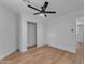 Neutral bedroom with closet, ceiling fan, light walls and wood-look floors throughout at 16611 N 19Th St, Phoenix, AZ 85022