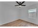 Clean, empty bedroom with hardwood floors and a ceiling fan at 16611 N 19Th St, Phoenix, AZ 85022