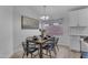 Dining room with modern chandelier, decorative painting, and table set for six at 16611 N 19Th St, Phoenix, AZ 85022