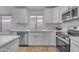 Modern kitchen with white cabinets, stainless steel appliances, and subway tile backsplash at 16611 N 19Th St, Phoenix, AZ 85022