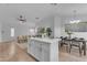 Open-concept living area with a kitchen island, dining space, and modern decor, perfect for entertaining at 16611 N 19Th St, Phoenix, AZ 85022