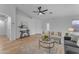 Bright and airy living room features wood floors, neutral furniture, and tasteful decorations at 16611 N 19Th St, Phoenix, AZ 85022