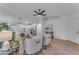 Open concept living space with bright white walls, light wood floors and modern ceiling fan at 16611 N 19Th St, Phoenix, AZ 85022