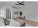 Relaxing main bedroom suite with wood floors, contemporary decor, and access to ensuite bathroom at 16611 N 19Th St, Phoenix, AZ 85022