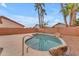 Backyard featuring a sparkling pool with stone accents, landscaping, and patio areas at 16611 N 19Th St, Phoenix, AZ 85022