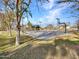 Outdoor basketball court, part of the community recreation facilities with trees providing shade at 18556 W Vogel Ave, Goodyear, AZ 85338