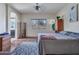 Serene bedroom featuring a comfortable bed, arched doorways, and plenty of natural light at 18556 W Vogel Ave, Goodyear, AZ 85338