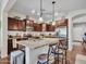 Beautiful kitchen with dark cabinetry, stainless appliances, and a breakfast bar at 18556 W Vogel Ave, Goodyear, AZ 85338