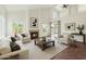 Bright living room with high ceilings, fireplace, and access to outdoor patio at 18845 N 43Rd St, Phoenix, AZ 85050