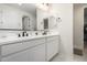 Elegant bathroom with double sinks, white quartz countertops, and a large mirror at 21743 N Daniel Dr, Maricopa, AZ 85138