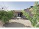 Expansive backyard featuring a covered patio and established greenery, perfect for outdoor entertaining and relaxation at 2201 W Wethersfield Rd, Phoenix, AZ 85029