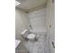 Modern bathroom featuring bright white shower and marble-look flooring at 2255 W Bloomfield Rd, Phoenix, AZ 85029