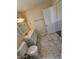 Bright bathroom featuring gray marble floors, a white vanity, and a toilet at 2255 W Bloomfield Rd, Phoenix, AZ 85029