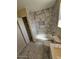 Bathroom featuring a tiled shower, bathtub, and toilet with marble floors at 2255 W Bloomfield Rd, Phoenix, AZ 85029