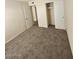 Cozy bedroom with neutral carpet, closet, and easy access to the hallway at 2255 W Bloomfield Rd, Phoenix, AZ 85029