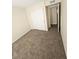 Bedroom showcasing carpet floors, neutral colors, and closet space at 2255 W Bloomfield Rd, Phoenix, AZ 85029