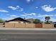 Two-story home with block perimeter fence and desert landscaping at 2255 W Bloomfield Rd, Phoenix, AZ 85029