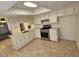 Bright kitchen featuring light countertops, white cabinetry, and stainless steel appliances at 2255 W Bloomfield Rd, Phoenix, AZ 85029