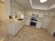 Bright kitchen featuring light countertops, white cabinetry, and stainless steel appliances at 2255 W Bloomfield Rd, Phoenix, AZ 85029