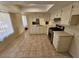 Bright kitchen featuring light countertops, white cabinetry, and stainless steel appliances at 2255 W Bloomfield Rd, Phoenix, AZ 85029