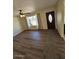 Inviting living room features wood floors, a ceiling fan, and natural light at 2255 W Bloomfield Rd, Phoenix, AZ 85029